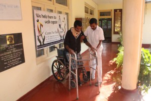 CENTRE FOR HANDICAPPED MR PRASANA WITH WALKING DEVICE